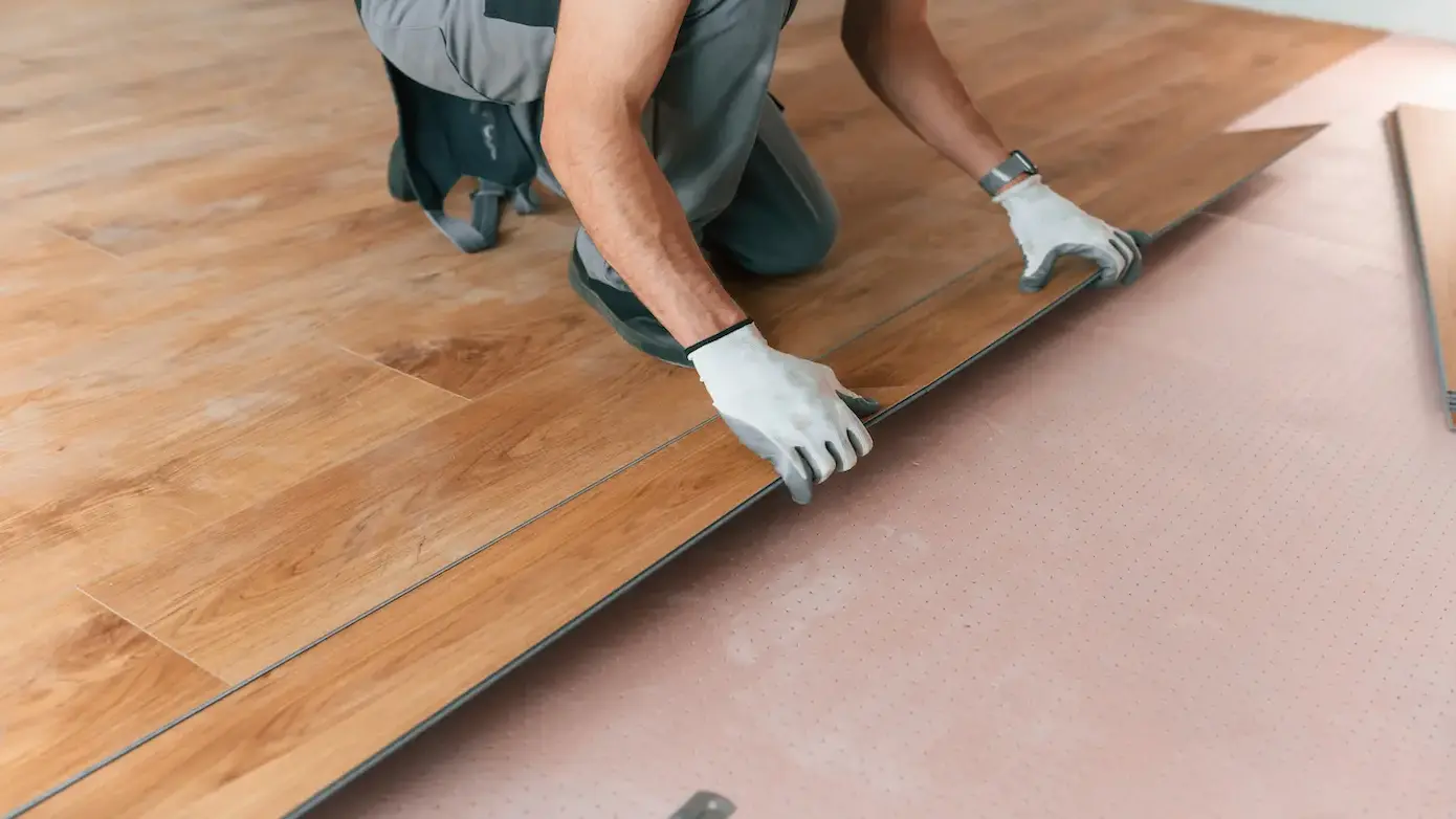 hand work man is installing new wooden